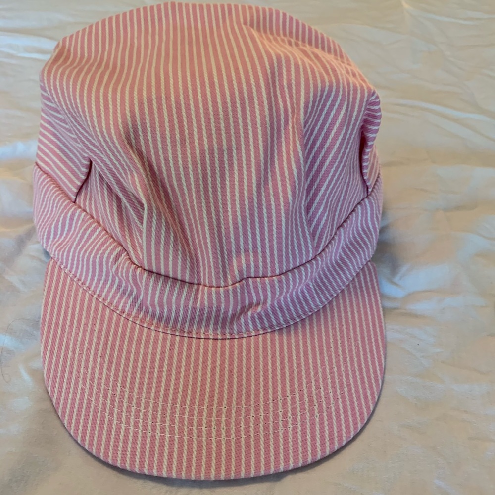 Pink striped train engineer hat.